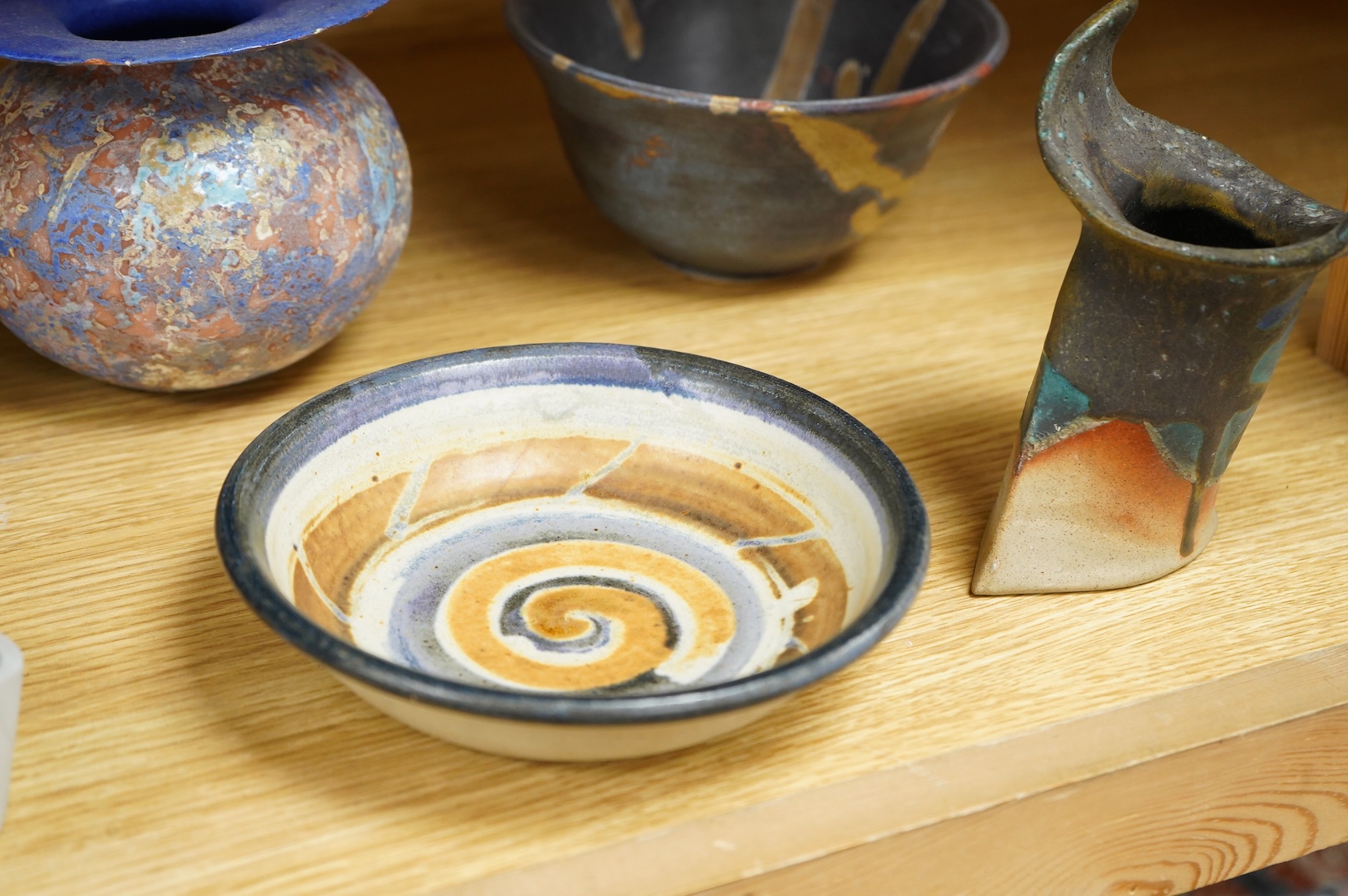 A collection of studio pottery to include crystalline glazed works by Stephen R Jones Des, Brighton, vases and a pair of dishes, largest 22cm high